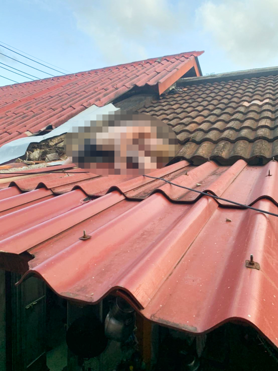 Aussie man's lifeless body pictured on the roof. 