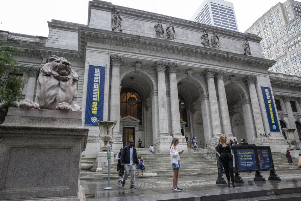 FILE - A "Read Banned Books" banner hangs on the front of the Main Branch of the New York Public Library on 5th Avenue in Manhattan during Banned Books Week in New York City on Thursday, September 22, 2022. With book bannings surging nationwide over the past two years, the library and publishing associations are urging “all members of the book community" to affirm their commitment to the June 1953 declaration. (AP Photo/Ted Shaffrey, File)