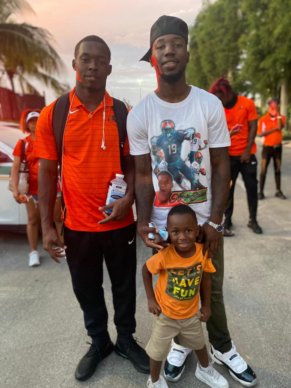 Florida A&M University wide receiver Xavier Smith and brother Kareem Smith poses for a photo with a young relative