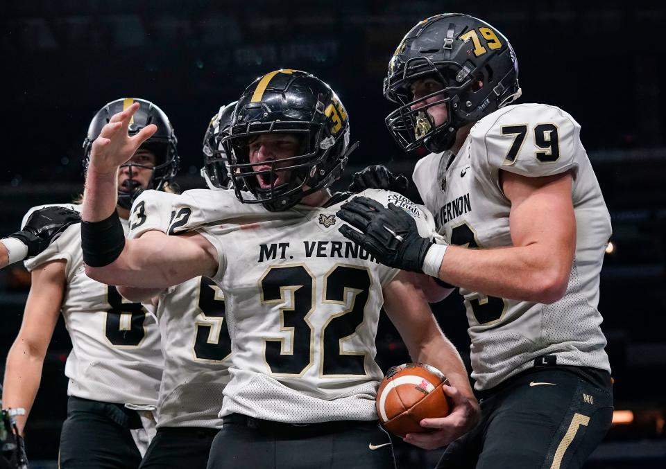 Mt. Vernon Marauders Keagan Labelle (32) yells in excitement after a touchdown during the IHSAA Class 4A State Finals on Saturday, Nov. 27, 2021, at Lucas Oil Stadium in Indianapolis. Mt. Vernon Marauders lead at the half against the Northridge Raiders, 26-7. 