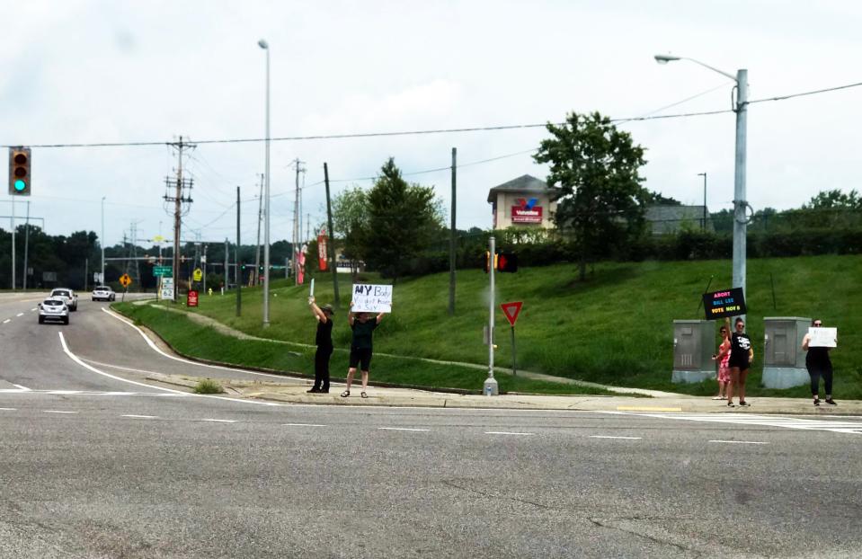 People against the recent decision on abortion picket at the corner of Oak Ridge Turnpike and South Illinois Avenue on Sunday, July 17, 2022.