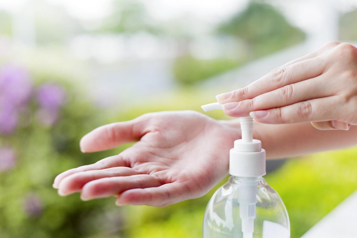 Closeup of hand pumping gel sanitizer