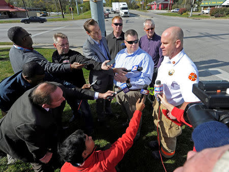 Atchison Fire Chief Ted Graf (R) and City Manager Trey Cocking speak to the press following a chemical spill near a MGP Ingredients plant that caused a toxic cloud that injured dozens of people and forced an evacuation in downtown Atchison, Kansas, U.S., October 21, 2016. REUTERS/Dave Kaup