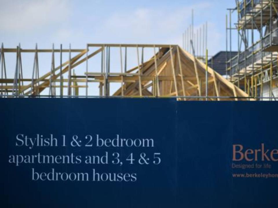 Builders work on a residential construction site in Paddock Wood (AFP via Getty)