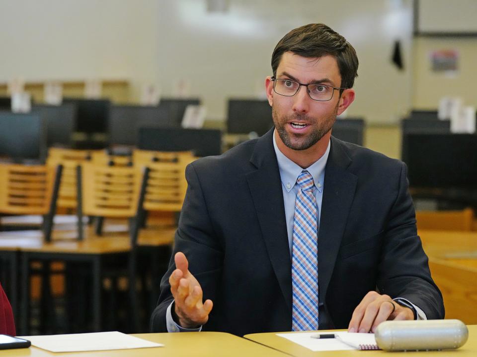 David Hondula, director of heat response and mitigation for the city of Phoenix, speaks during a listening session at Cesar Chavez High School Library on April 20, 2022, in Phoenix.