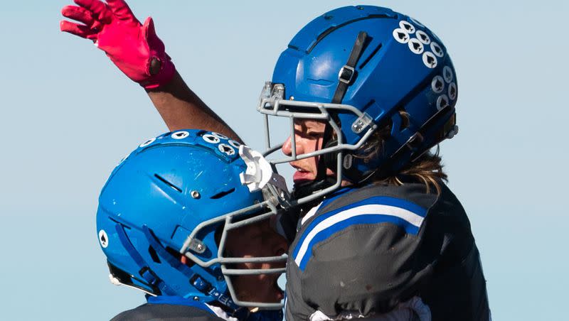 Rich High School’s Jaden Desch, right, and Jack Bell celebrate after Desch’s touchdown during the 1A 8-player football state championship agains Monticello High School at Southern Utah University in Cedar City on Saturday, Nov. 11, 2023.