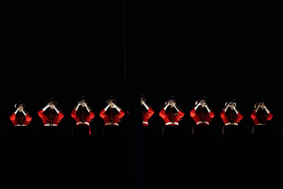 Marine Corps members perform at a parade at Marine Barracks as President Joe Biden attends Friday, June 2, 2023, in Washington. (AP Photo/Andrew Harnik)