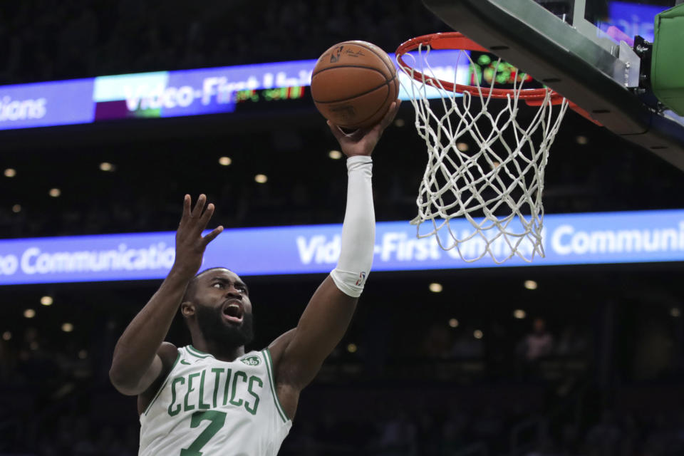 Boston Celtics guard Jaylen Brown drives to the basket against the Detroit Pistons during the first half of an NBA basketball game in Boston, Wednesday, Jan. 15, 2020. (AP Photo/Charles Krupa)