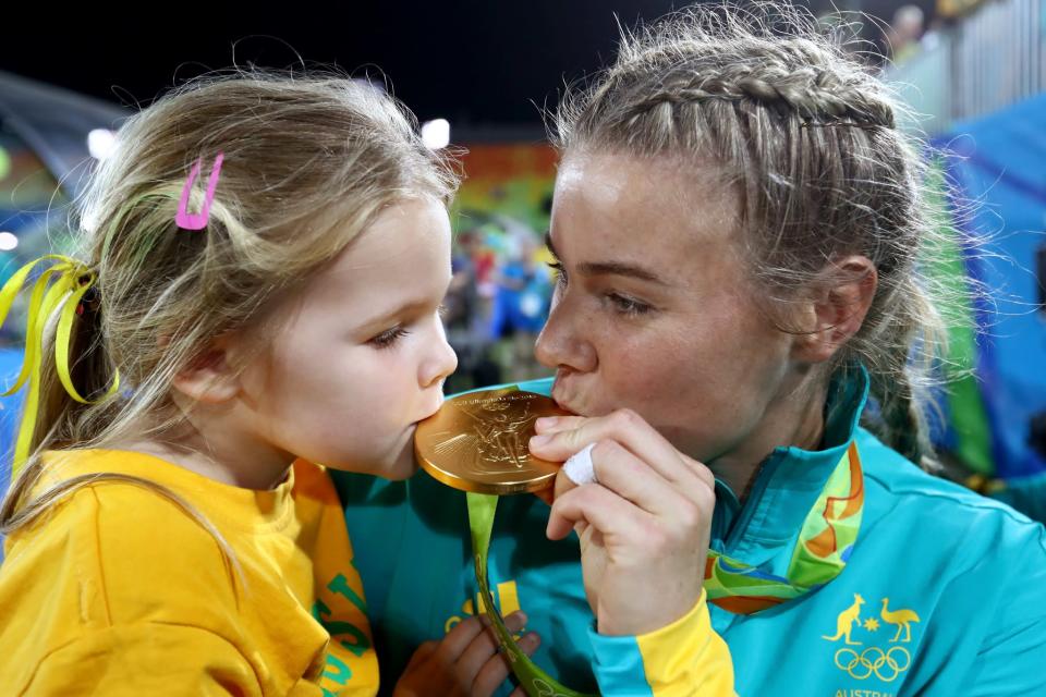 <p>Nicole Beck of Australia kisses her Gold medal with her daughter Sophie Beck after the medal ceremony for the Women’s Rugby Sevens on Day 3 of the Rio 2016 Olympic Games at the Deodoro Stadium on August 8, 2016 in Rio de Janeiro, Brazil. (Photo by Alexander Hassenstein/Getty Images) </p>