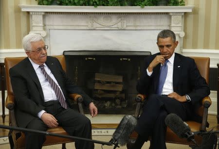 U.S. President Barack Obama meets with Palestinian Authority President Mahmoud Abbas (L) at the White House in Washington March 17, 2014. REUTERS/Kevin Lamarque