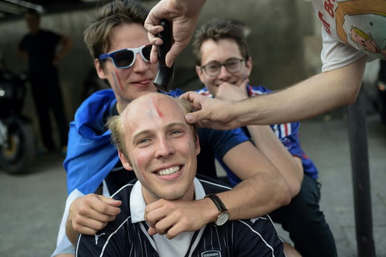 A French fan got his head shaved to honour his team's World Cup win