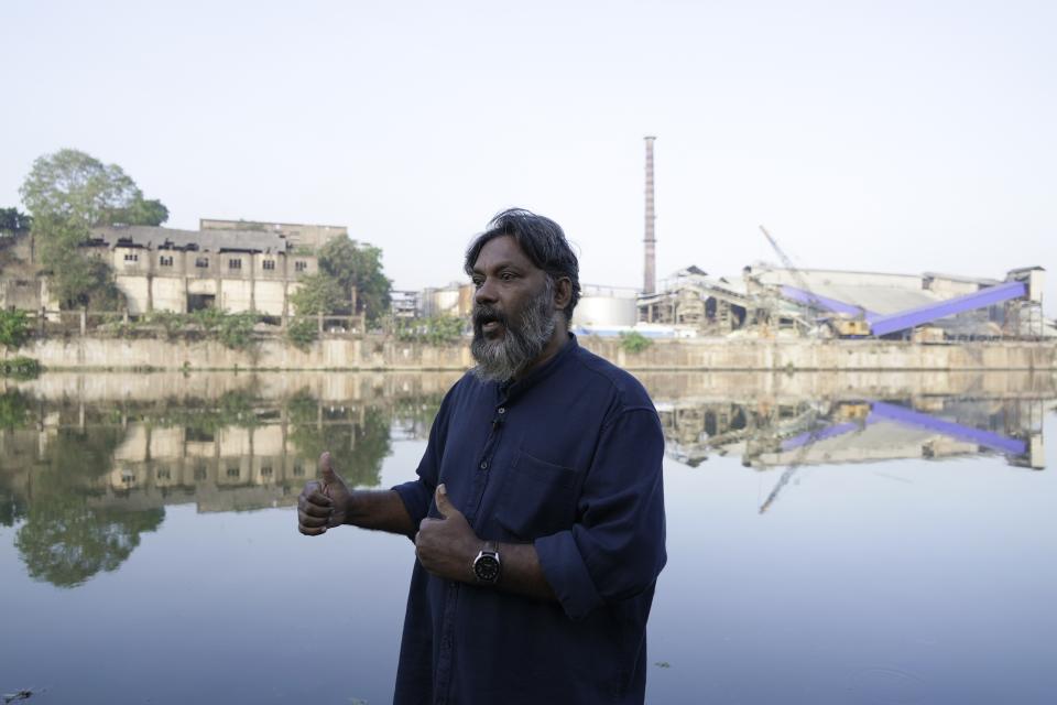 Anwar C. I., an official of the Periyar River anti-pollution committee, speaks during an interview along the river in Eloor, Kerala state, India, Friday, March 3, 2023. He said residents have grown accustomed to the all-pervasive reek that seems to hang over the place like a heavy curtain, enveloping everything and everyone. (AP Photo)