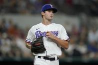 Texas Rangers pitcher Cole Ragans jogs to the dugout after throwing to the Chicago White Sox during the first inning of a baseball game Thursday, Aug. 4, 2022, in Arlington, Texas. (AP Photo/Tony Gutierrez)