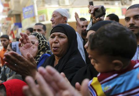 Relatives and families of members of the Muslim Brotherhood and supporters of ousted Egyptian President Mohamed Mursi react outside a court in Minya, south of Cairo, after the sentences of Muslim Brotherhood leader Mohamed Badie and his supporters were announced, June 21, 2014.REUTERS/Mohamed Abd El Ghany