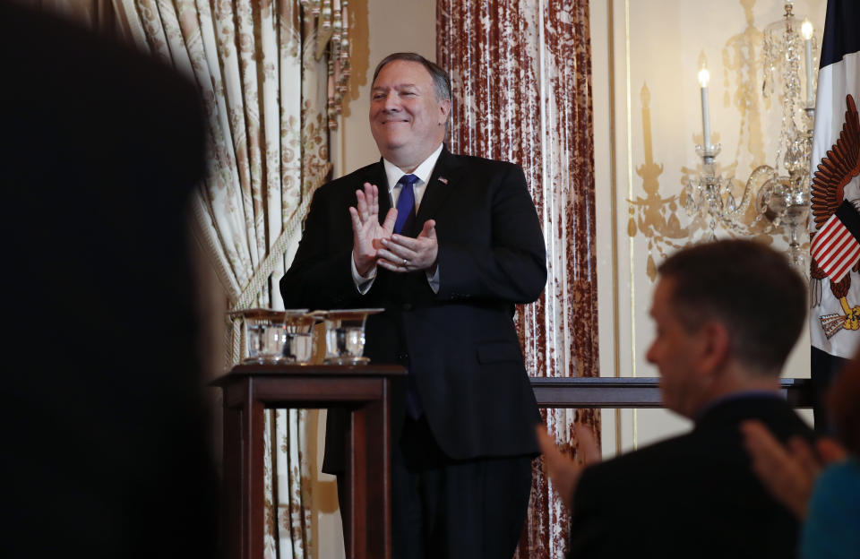 Secretary of State Mike Pompeo applauds during the announcement of the World Food Prize Laureate at the State Department, Monday, June 10, 2019. Simon N. Groot of the Netherlands, founder of East-West Seed, will receive the 2019 World Food Prize. (AP Photo/Pablo Martinez Monsivais)