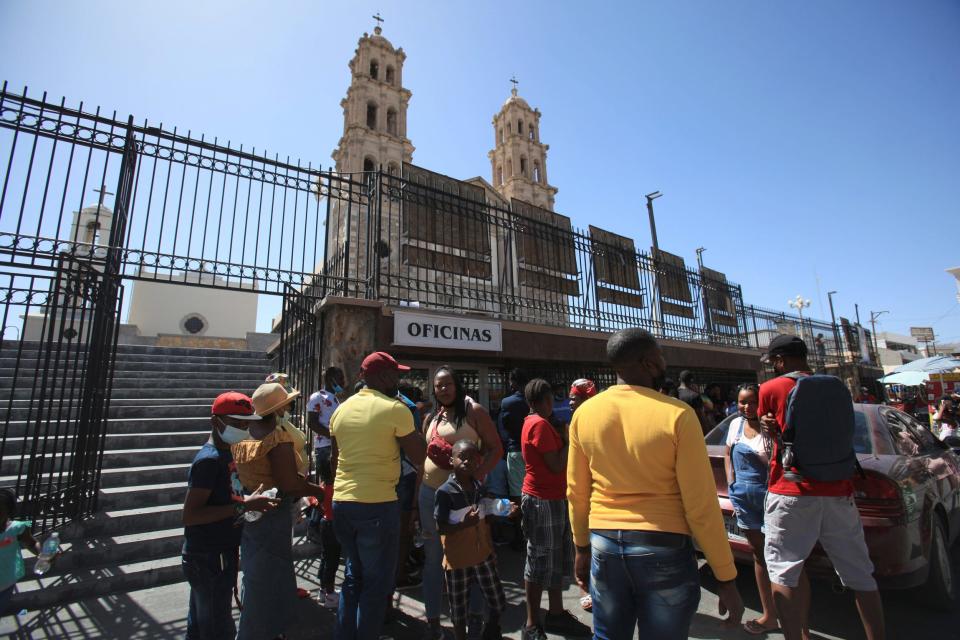 Hundreds of Haitian migrants congregated outside the Juárez cathedral on Friday after rumors spread that the diocese would be able to help migrants enter the U.S. on the day that Title 42 was set to remain in place by a U.S. federal judge.