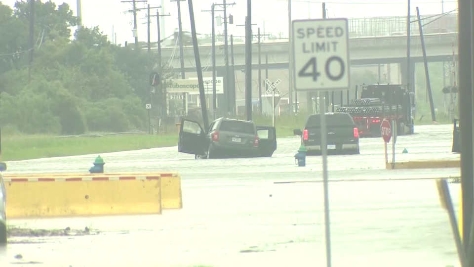 Drivers abandon their cars as Tropical Storm Beta floods roads in Houston. / Credit: KHOU