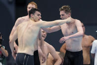 Britain's men's 4x200-meters relay team of Tom Dean, James Guy, Matthew Richards, and Duncan Scott celebrate after winning at the 2020 Summer Olympics, Wednesday, July 28, 2021, in Tokyo, Japan. (AP Photo/Martin Meissner)