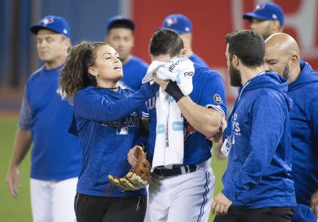 Randal Grichuk fouls ball off his face