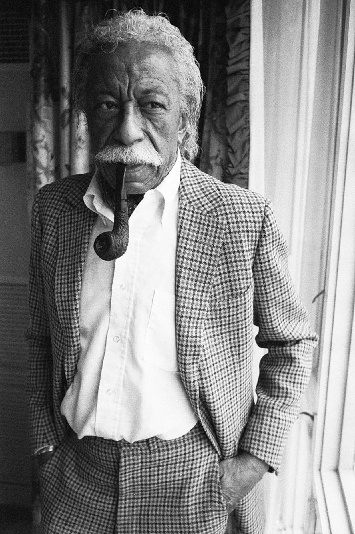 Gordon Parks Smoking a Pipe (Shepard Sherbell / Getty Images)