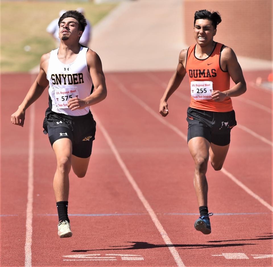 Snyder's Jay Castillo, left, races Dumas' Oliver Ortiz to the finish line in the 400 meters at the Region I-4A track and field meet Saturday at Lowrey Field in Lubbock. Castillo won the race in 48.65 seconds, followed by Ortiz in 48.92.