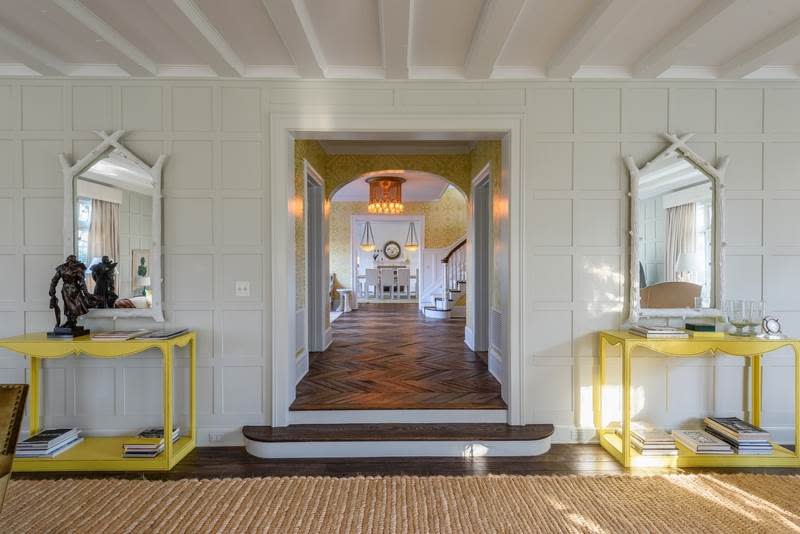 <p>The home’s entrance is stunning with its herringbone-patterned wood floor and elegant white-beamed ceilings. (Christie’s International Real Estate) </p>