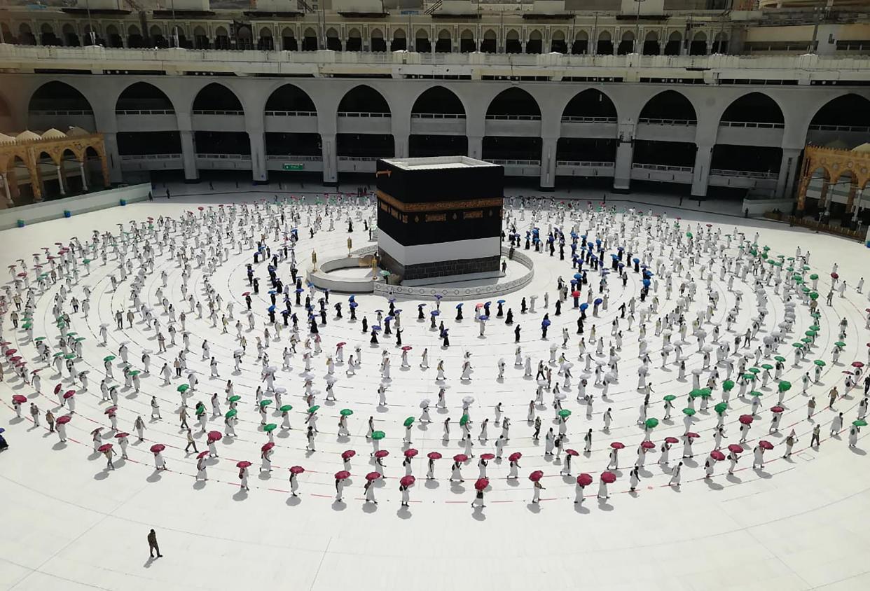 Hundreds of Muslim pilgrims circle the Ka'bah, the cubic building at the Grand Mosque,: AP