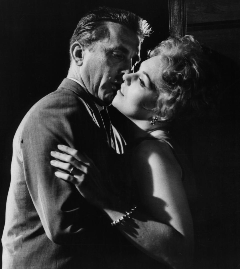 Kirk Douglas and Kim Novak embrace in a scene from the film 'Strangers When We Meet', 1960