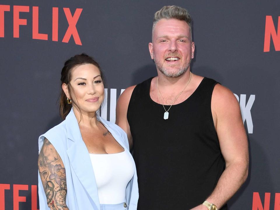 <p>JC Olivera/Getty</p> Pat McAfee and his wife, Samantha McAfee, attend the Los Angeles premiere of Netflix