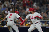 Philadelphia Phillies' Kyle Schwarber, right, celebrates with Bryson Stott after hitting a two-run home run against the San Diego Padres during the sixth inning of a baseball game Thursday, June 23, 2022, in San Diego. (AP Photo/Gregory Bull)