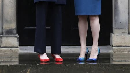 Scotland's First Minister, Nicola Sturgeon (R), greets Britain's new Prime Minister, Theresa May, as she arrives at Bute House in Edinburgh, Scotland, Britain July 15, 2016. REUTERS/Russell Cheyne