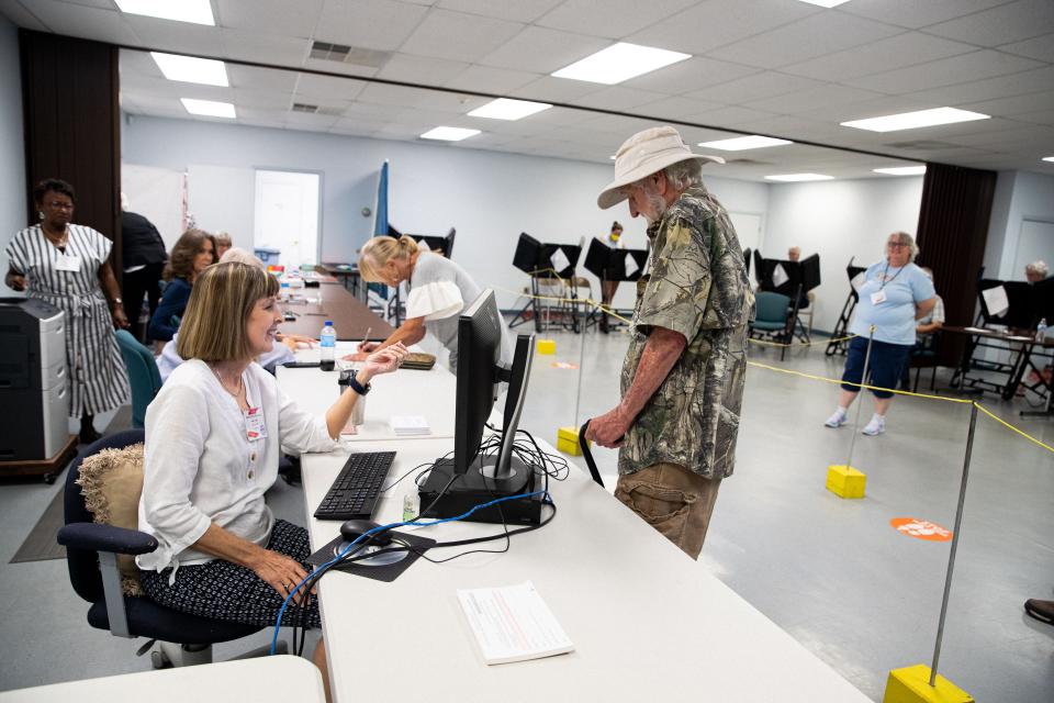 A man is checked into a polling station early voting in Columbia, TN. 