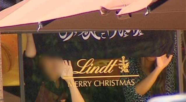 Hostages have been pressed against the window of the cafe in front of horrified witnesses. Photo: 7News