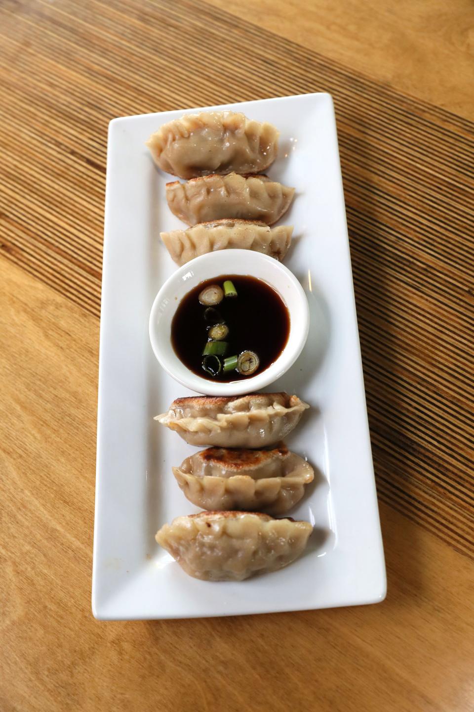 Noodles and dumplings, like these pan-fried Korean-style mandu with beef and kimchi, are made in the kitchen at Momo Mee Asian Cuisine, in MIlwaukee's Harbor District.