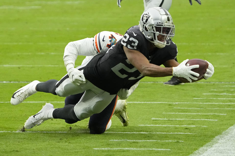 Chicago Bears inside linebacker Alec Ogletree (44) tackles Las Vegas Raiders running back Kenyan Drake (23) during the first half of an NFL football game, Sunday, Oct. 10, 2021, in Las Vegas. (AP Photo/Rick Scuteri)