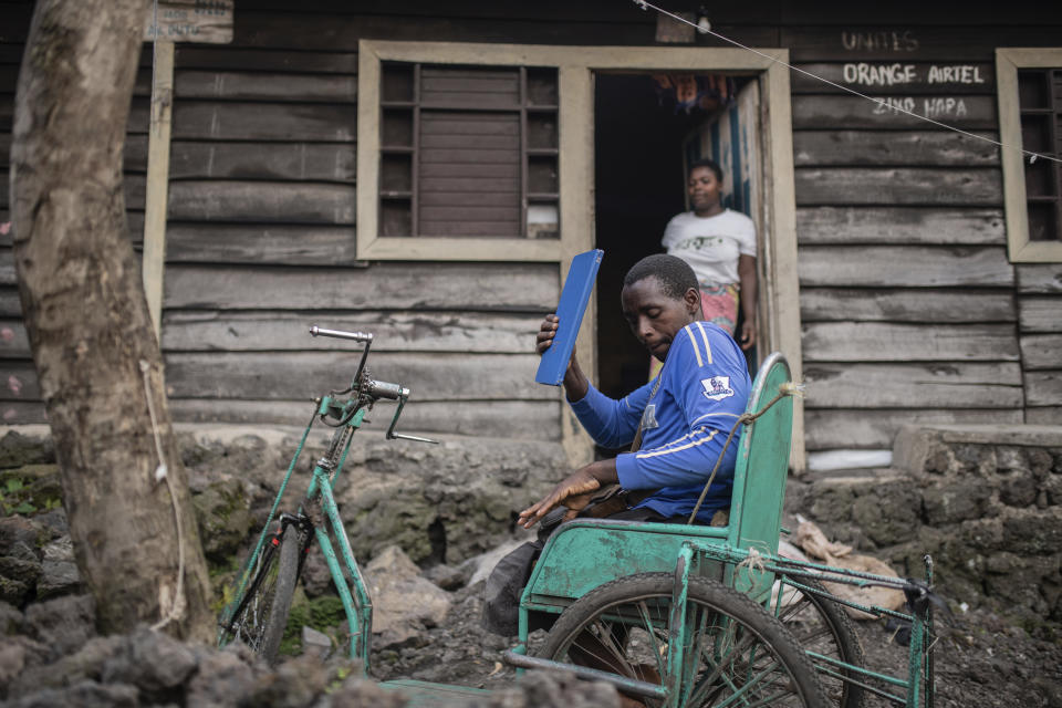 Paul Mitemberezi, a market vendor who has been disabled since he was 3 because of polio, leaves his house for the North Kivu Paralympic League to play basketball, in Goma, democratic Republic of Congo, Tuesday Jan. 17, 2023. When Pope Francis arrives in Congo and South Sudan Jan. 31, thousands of people will take special note of a gesture more grounded than the sign of the cross. Watching from their wheelchairs, they will relate to the way he uses his. (AP Photo/Moses Sawasawa)