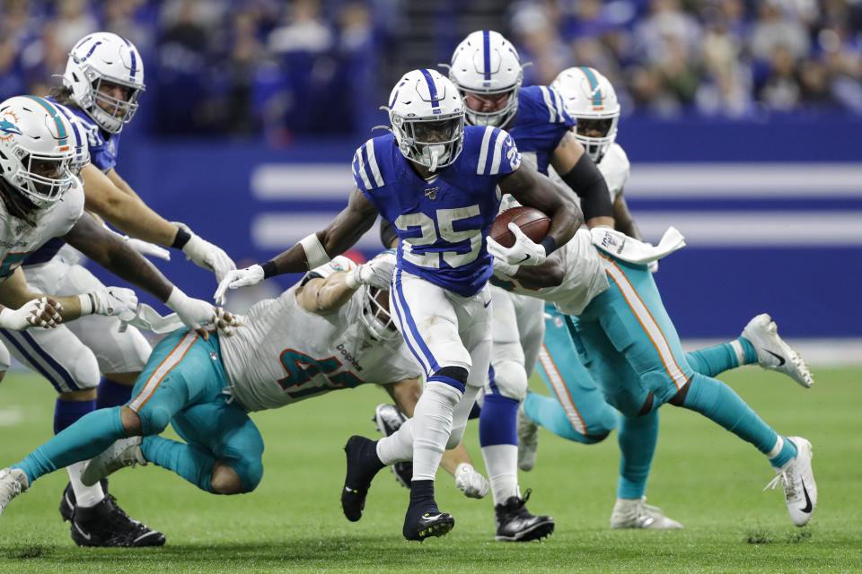 Indianapolis Colts running back Marlon Mack (25) carries against the Miami Dolphins during the second half of an NFL football game in Indianapolis, Sunday, Nov. 10, 2019. (AP Photo/Darron Cummings)