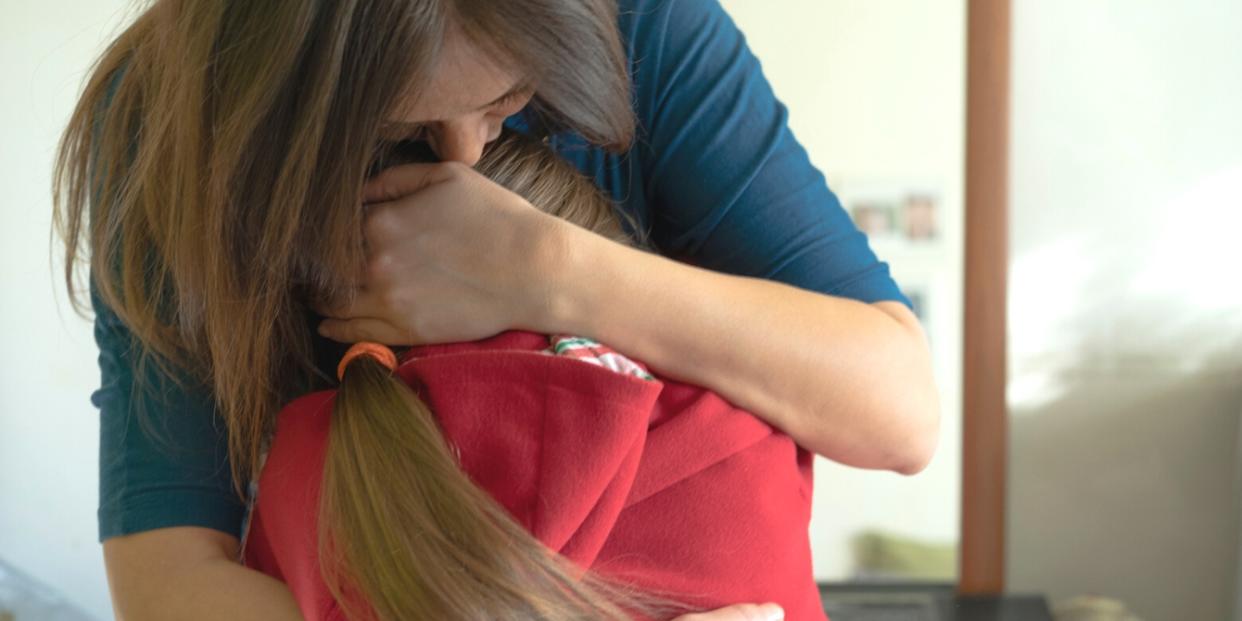 mom hugging ten year old daughter help child heal from trauma