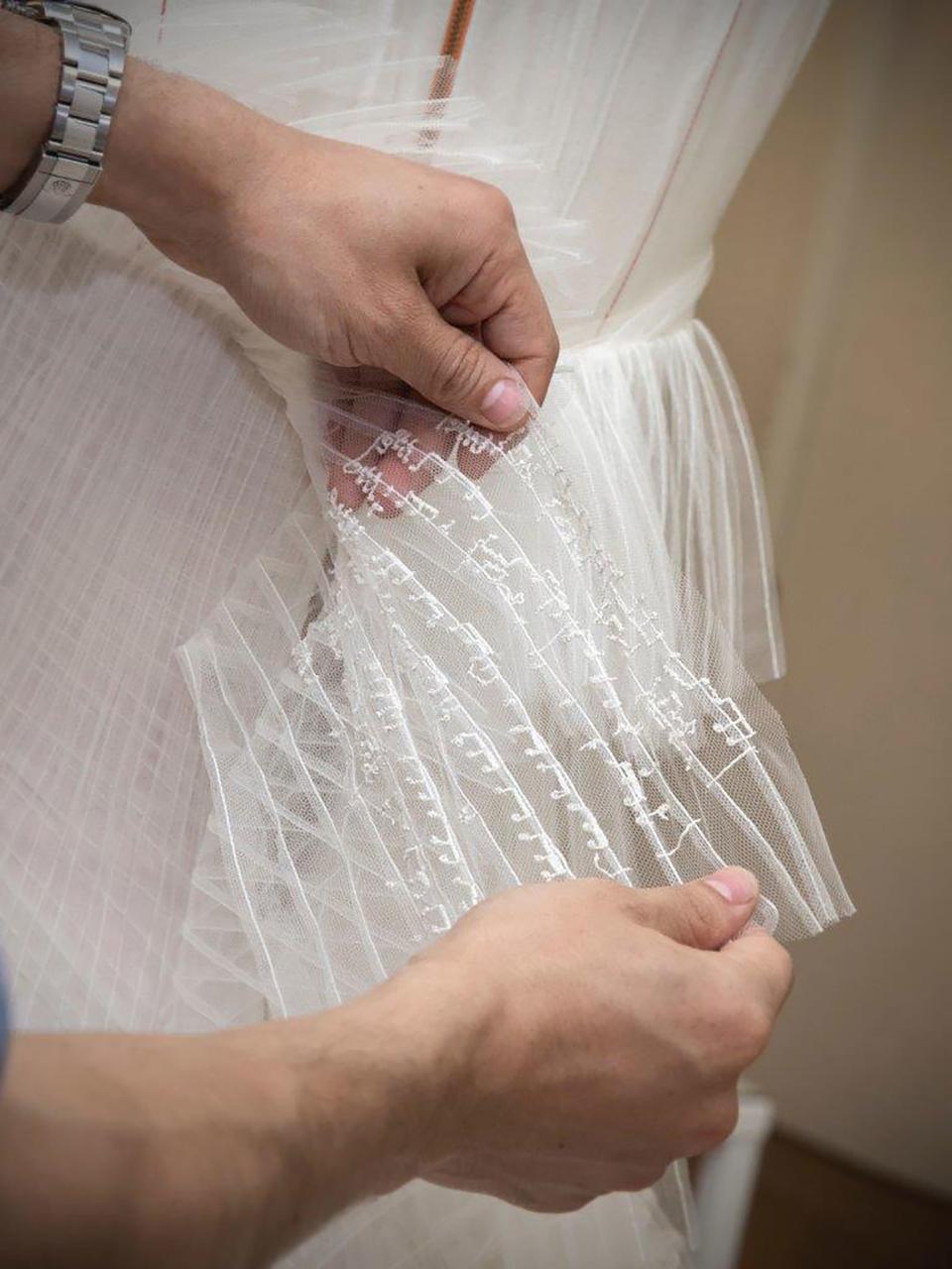 The dress beautifully incorporated multiple layers of striped tulle, and designer Zac Posen was a guest at the wedding.