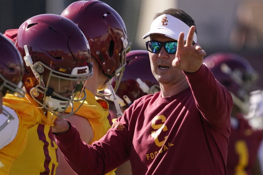 Southern California head coach Lincoln Riley talks with quarterback Caleb Williams.