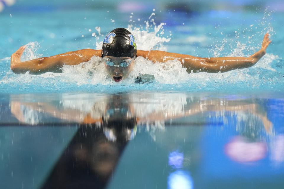 Torri Huske participates in the Women's 100 Butterfly during wave 2 of the U.S. Olympic Swim Trials on Monday, June 14, 2021, in Omaha, Neb. (AP Photo/Charlie Neibergall)