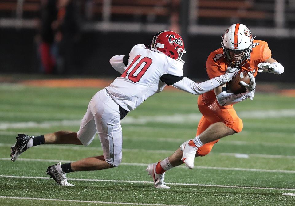 Massillon's Austin Brawley works to break the tackle of  Westerville South defender Jude Kowalski in the first half of a regional quarterfinal at Paul Brown Tiger Stadium, Nov. 5, 2021.