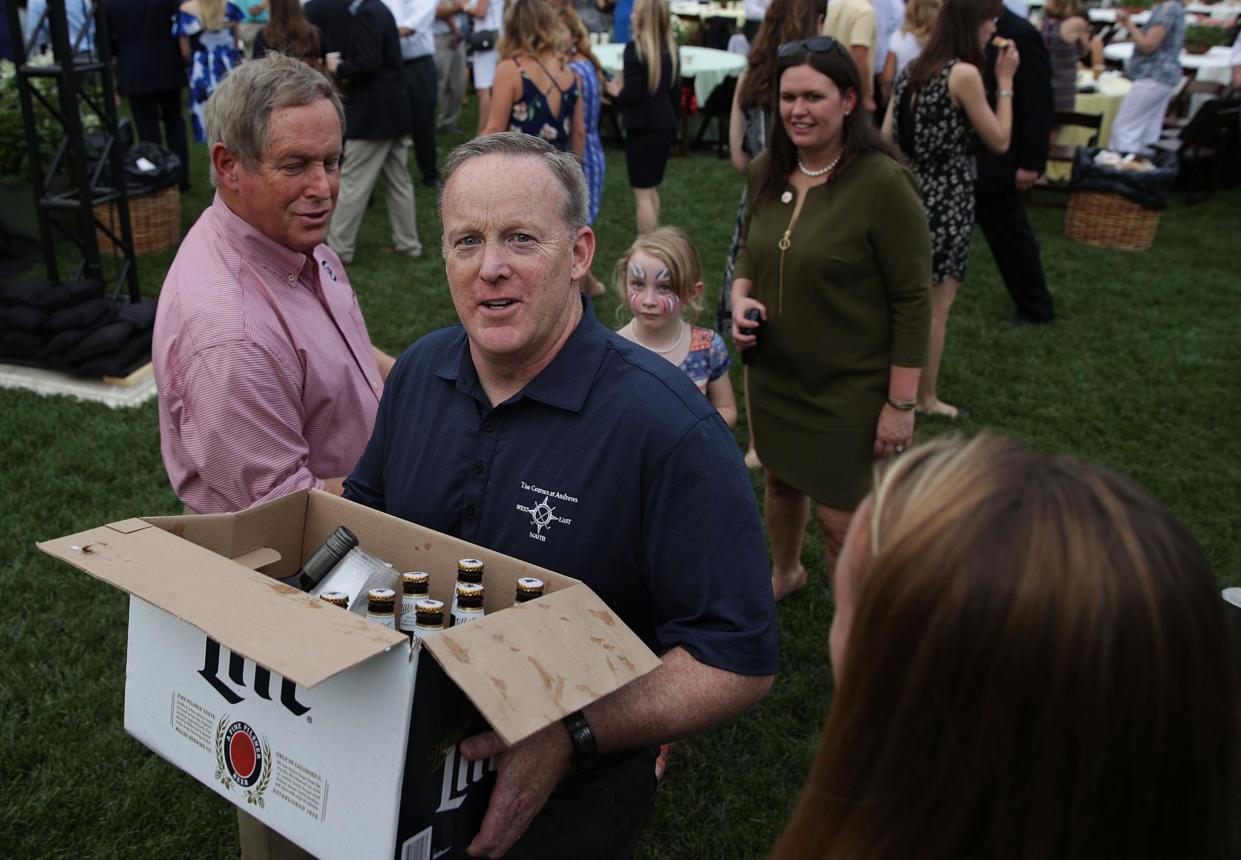 Mr Spicer is pictured at a White Hosue picnic: Getty Images