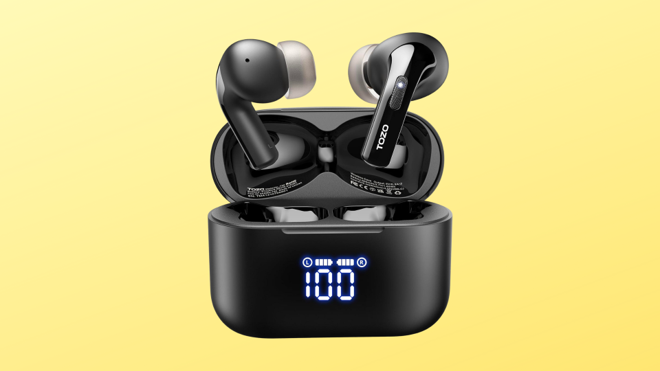 tozo earbuds against a yellow background