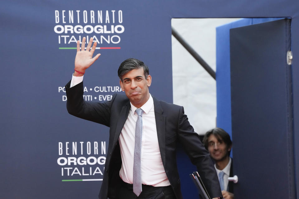 Britain's Prime Minister Rishi Sunak waves as he arrives at the annual political festival Atreju, organized by the Giorgia Meloni's Brothers of Italy political party, in Rome, Saturday, Dec. 16, 2023. (AP Photo/Alessandra Tarantino)