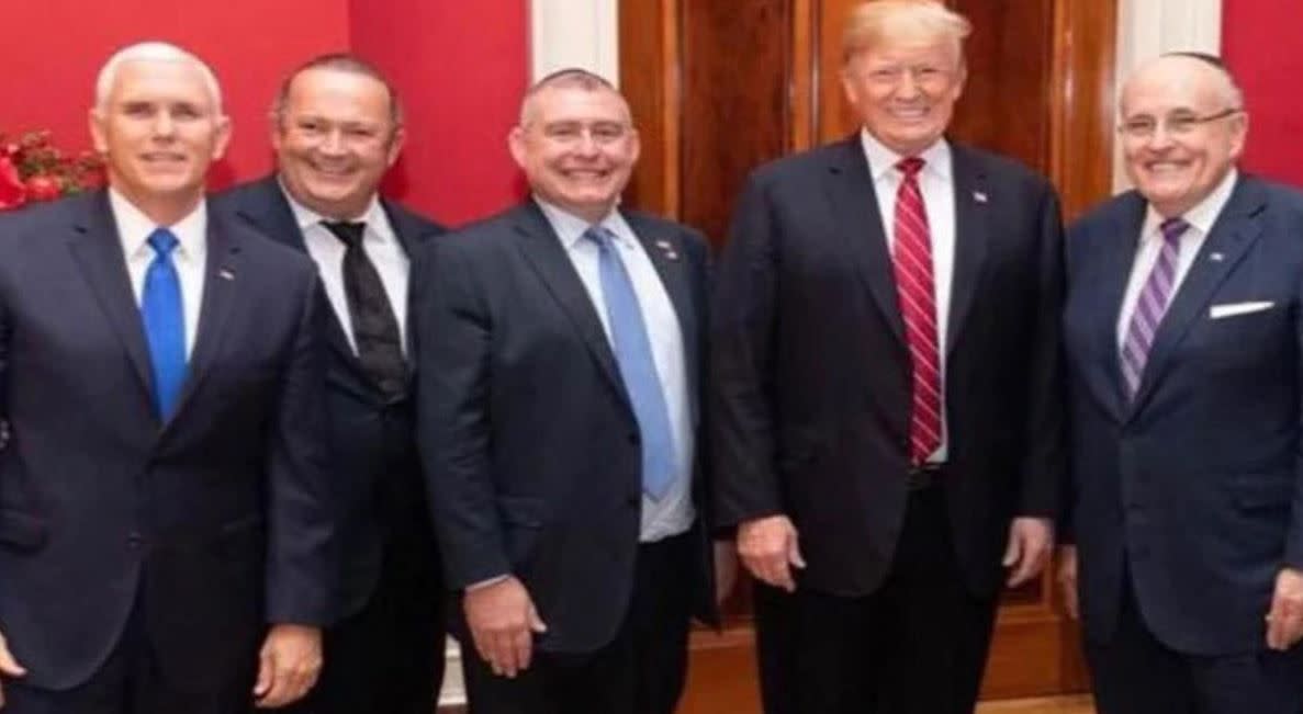 From left, Vice President Mike Pence, Igor Fruman, Lev Parnas, President Donald Trump and Rudy Giuliani are pictured in an undated photo.