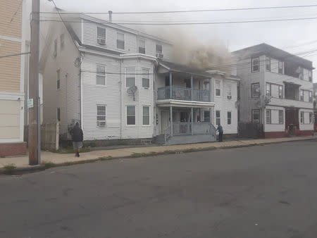 Smoke rises from a building after explosions in Lawrence, Massachusetts, United States in this September 13, 2018 photo from social media by Boston Sparks. Boston Sparks/Social Media/via REUTERS