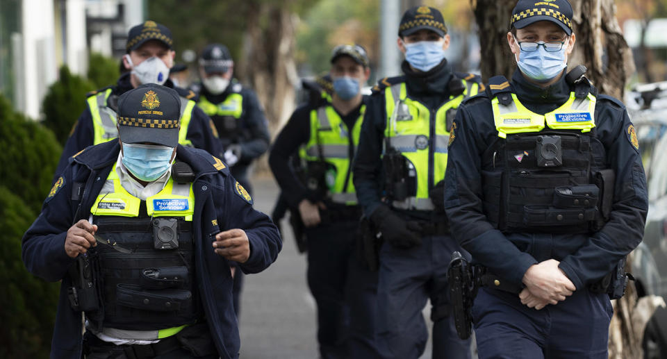 Police patrols are seen outside public housing towers in Flemington. Source: AAP