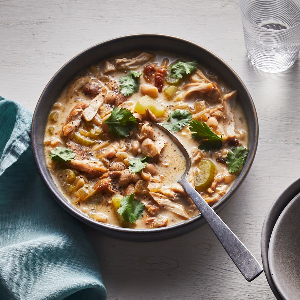 <p>This rich, yet healthy, white chicken chili comes together in a flash thanks to quick-cooking chicken thighs and canned white beans. Mashing some of the beans acts as a fast thickener when your soups don't have a long time to simmer. Cream cheese adds the final bit of richness and a hint of sweet tang. <a href="https://www.eatingwell.com/recipe/269831/creamy-white-chili-with-cream-cheese/" rel="nofollow noopener" target="_blank" data-ylk="slk:View Recipe;elm:context_link;itc:0;sec:content-canvas" class="link ">View Recipe</a></p>