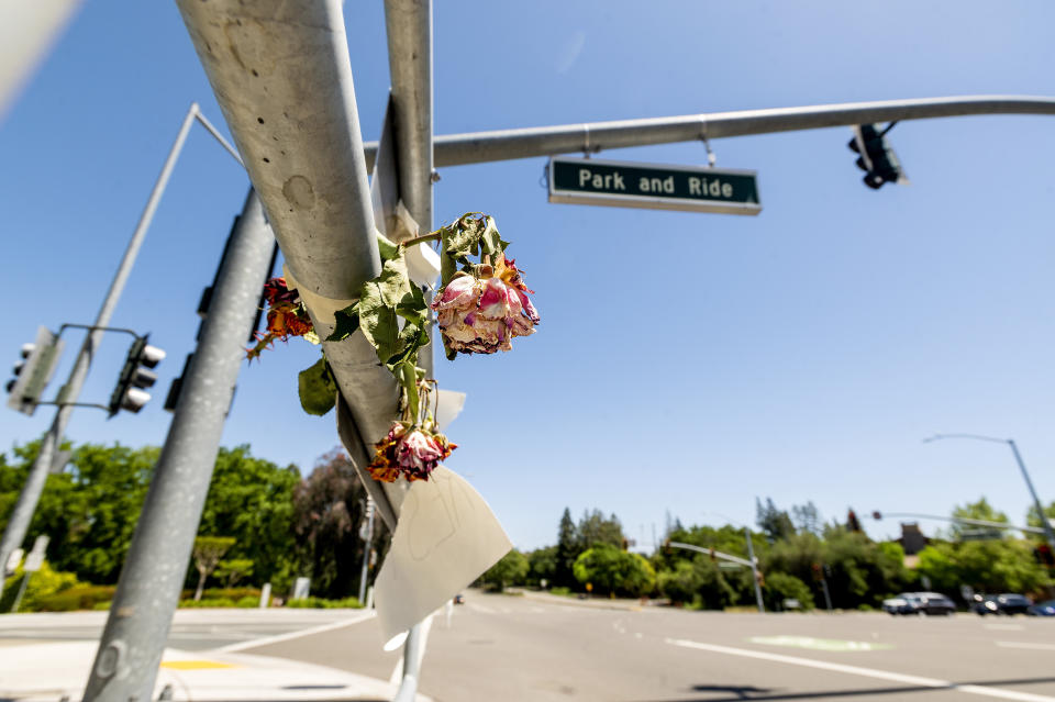 Flowers hang at a Danville, Calif., intersection where, in March, Danville police officer Andrew Hall shot and killed Tyrell Wilson as he held a knife on Monday, May 3, 2021. Wilson was shot and killed by Hall just weeks before prosecutors charged the same officer with manslaughter and assault in the fatal shooting of an unarmed Filipino man more than two years earlier. (AP Photo/Noah Berger)